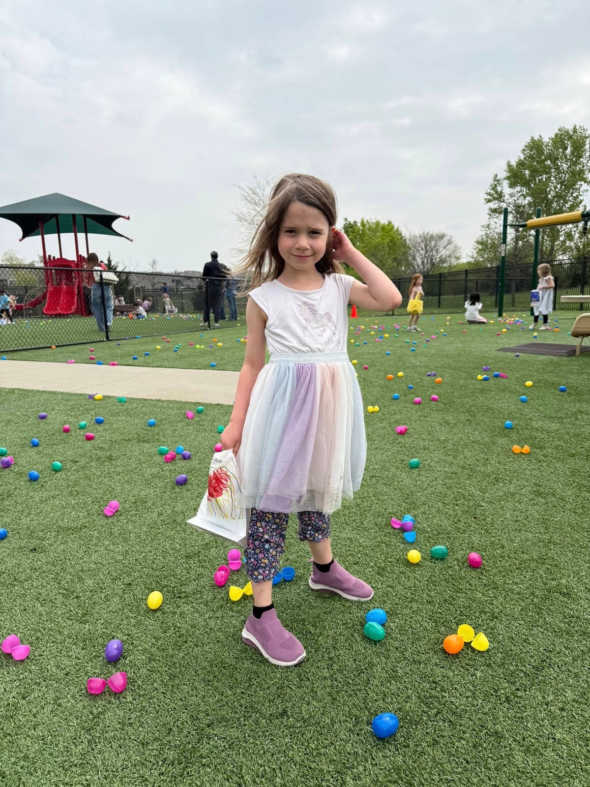 child looking for easter eggs