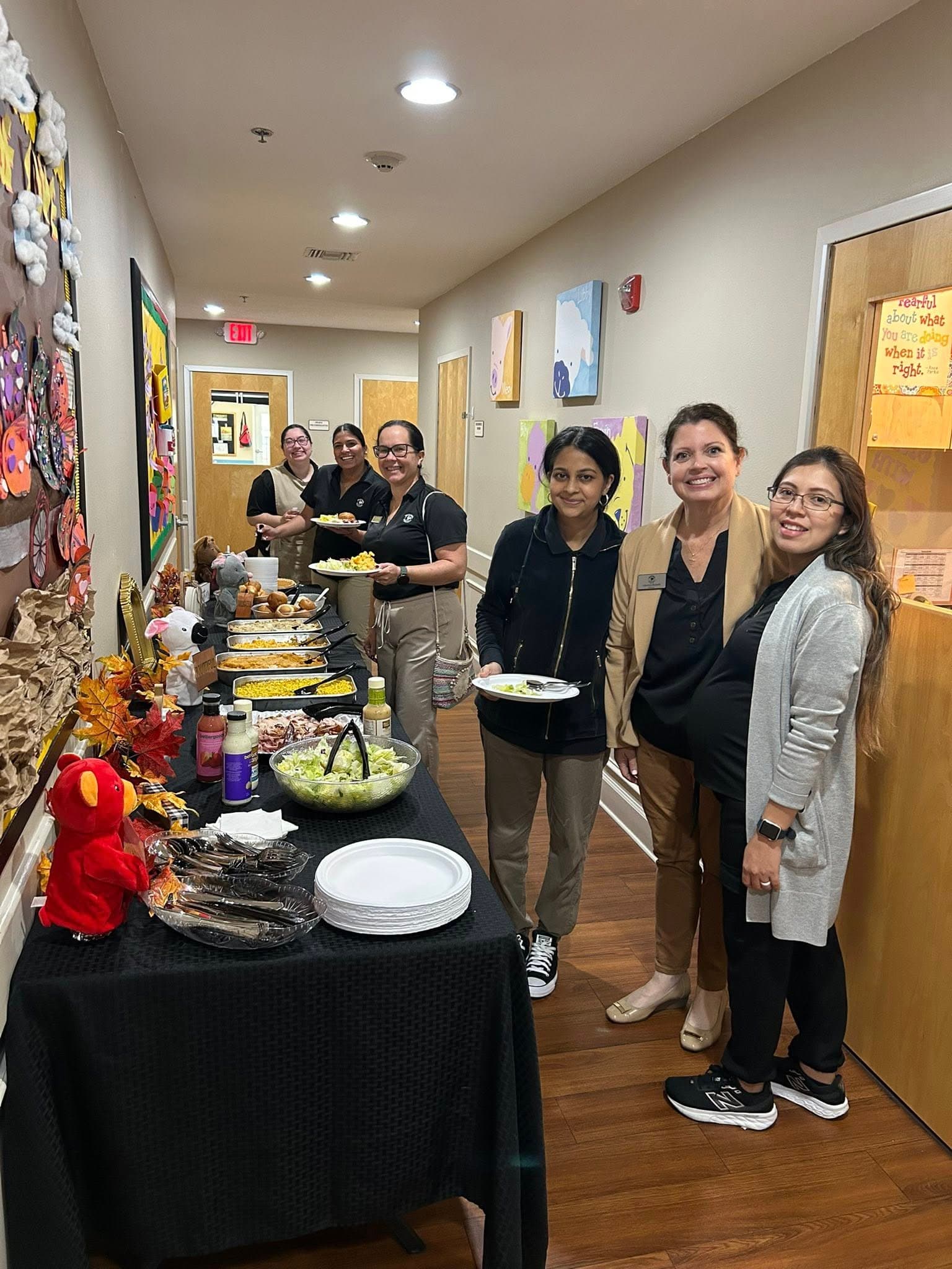 tables with food set up and teachers getting food