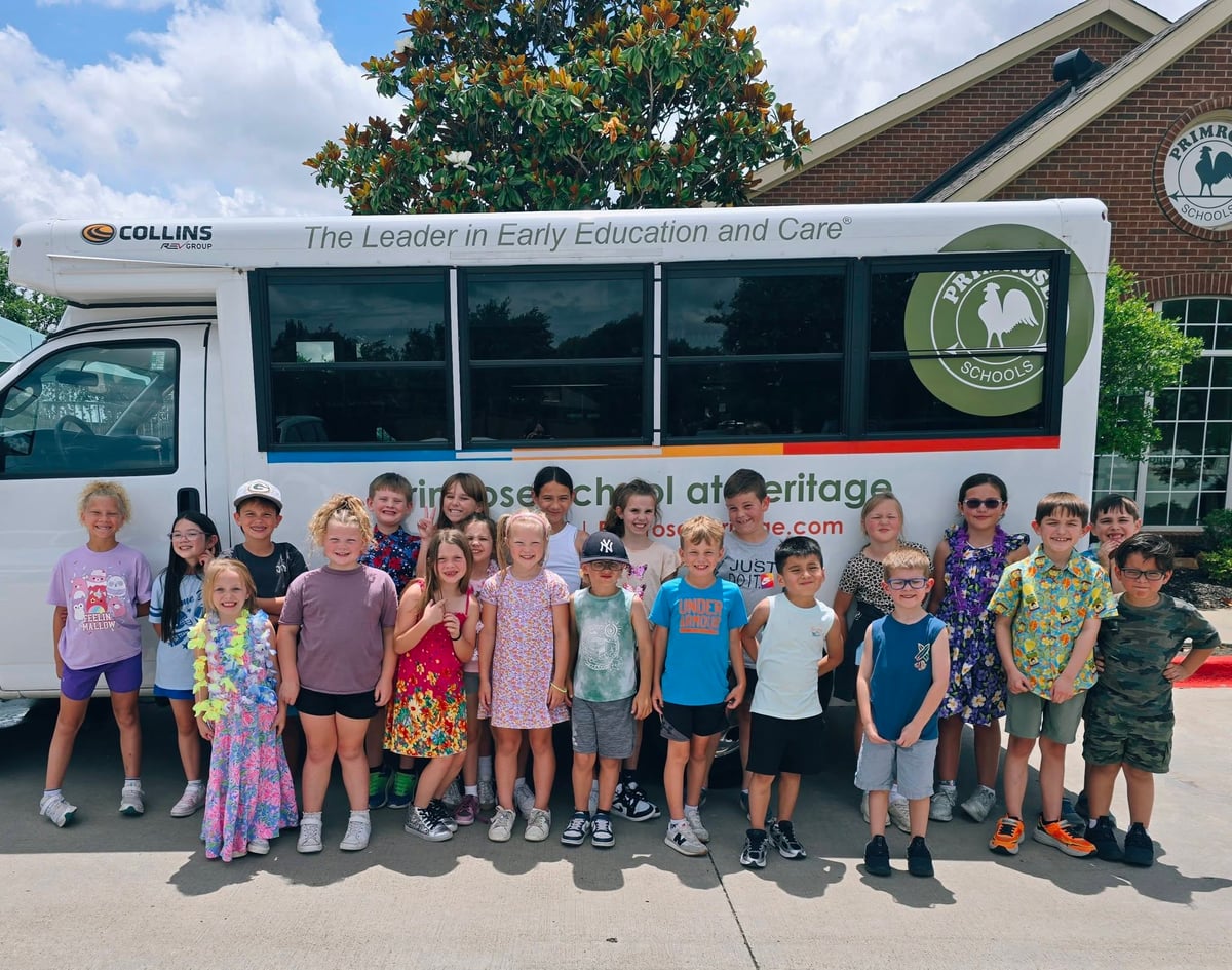 Summer Adventure Club students take a group picture after participating in a Bus Evacuation Drill.