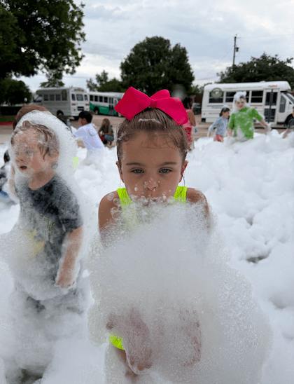 girl enjoying the bubble truck