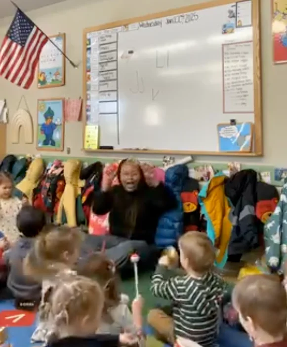 Preschool students participating in group musical lessons
