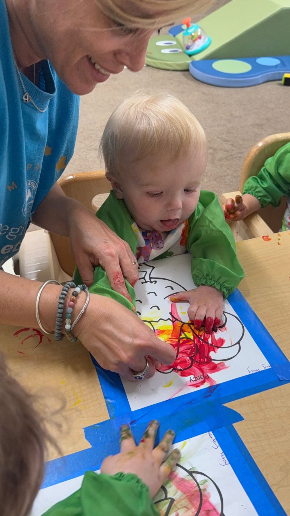 infant finger painting sensory art infant care daycare Four Points Austin childcare baby Riverplace