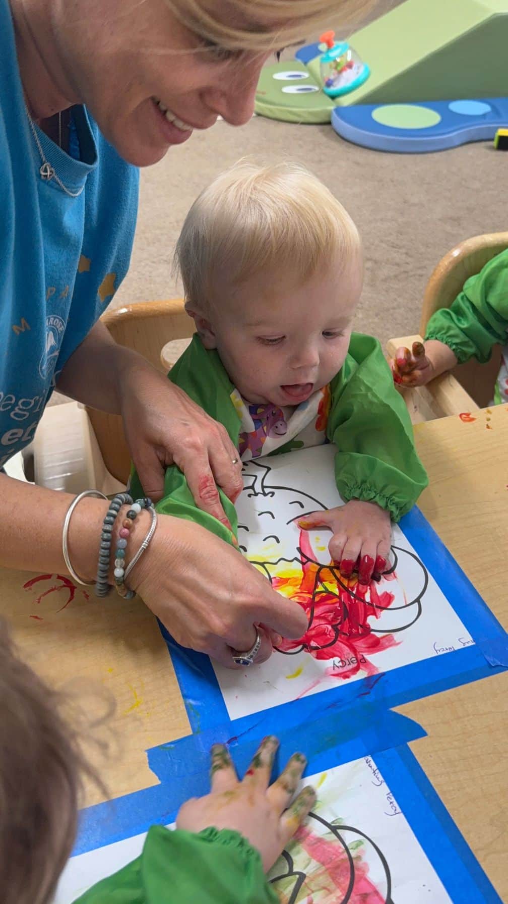 infant finger painting sensory art infant care daycare Four Points Austin childcare baby Riverplace