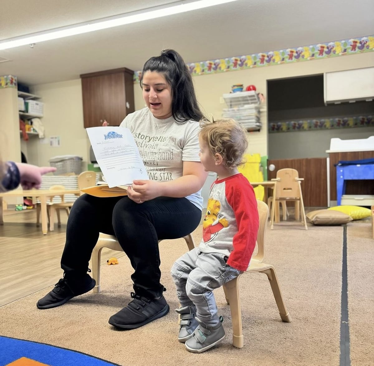 Teacher reading to student