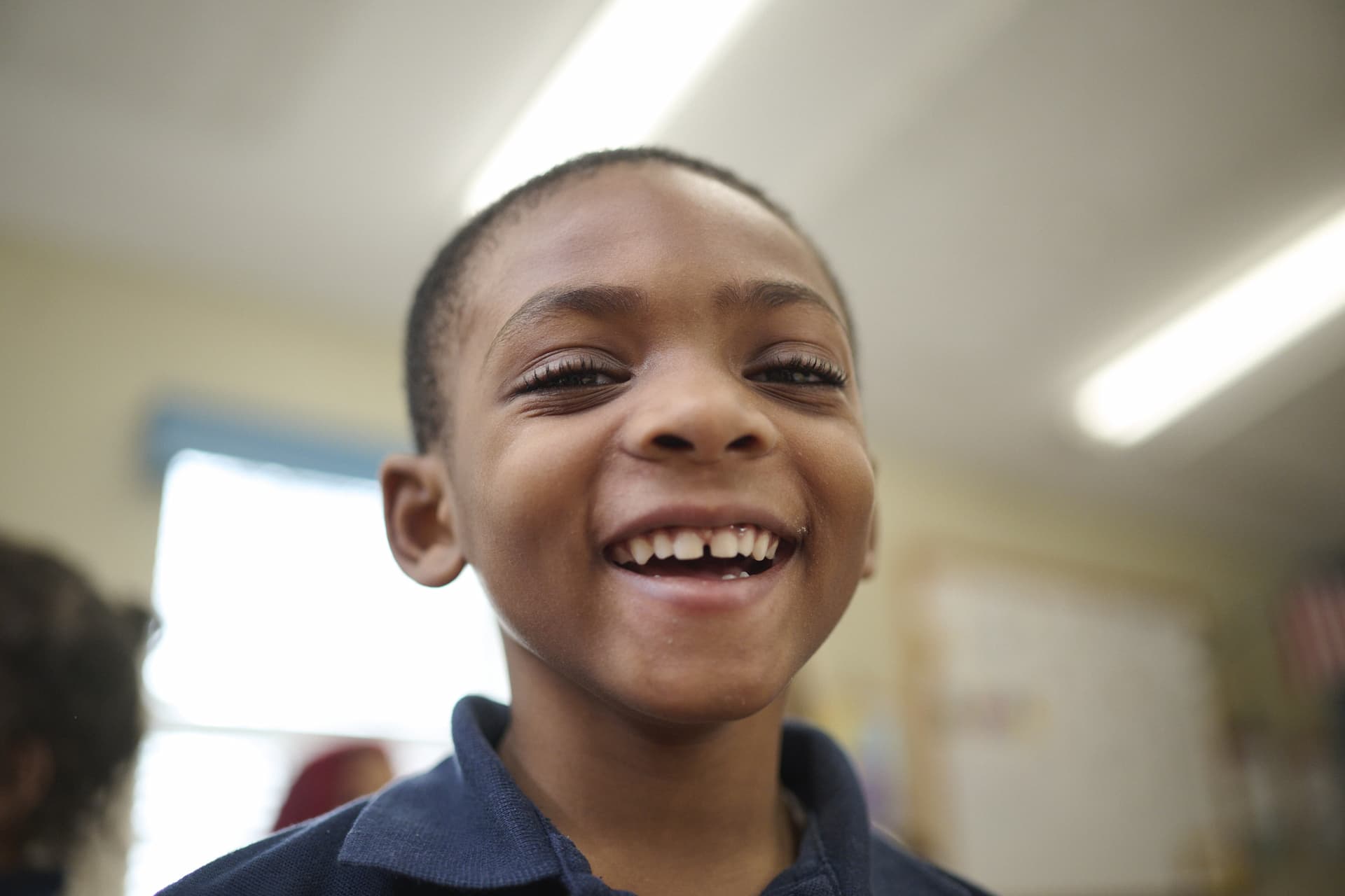 A young boy smiling at camera