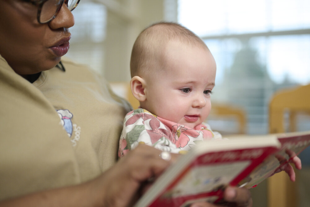 teacher reading to infant