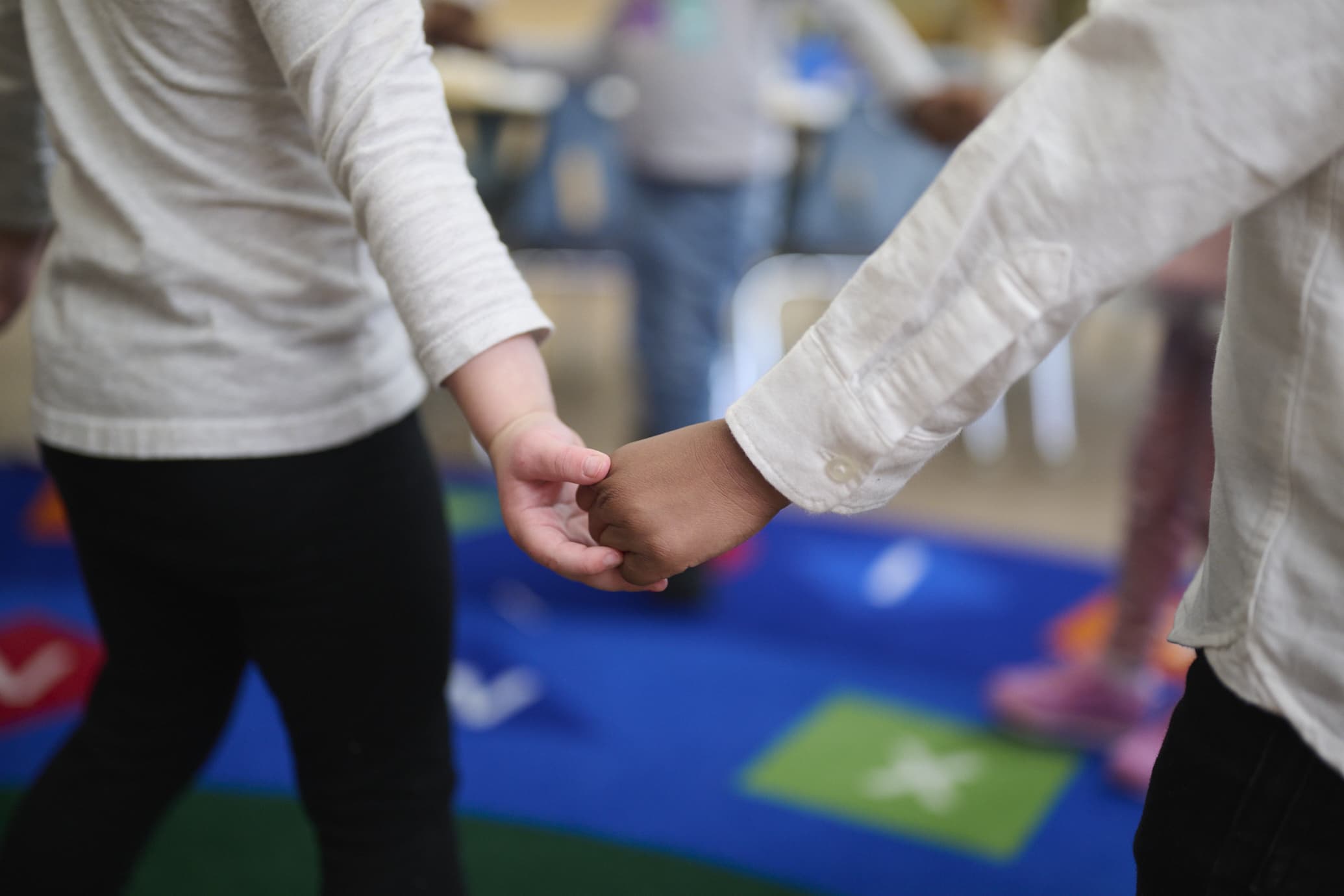 preschool children holding hands