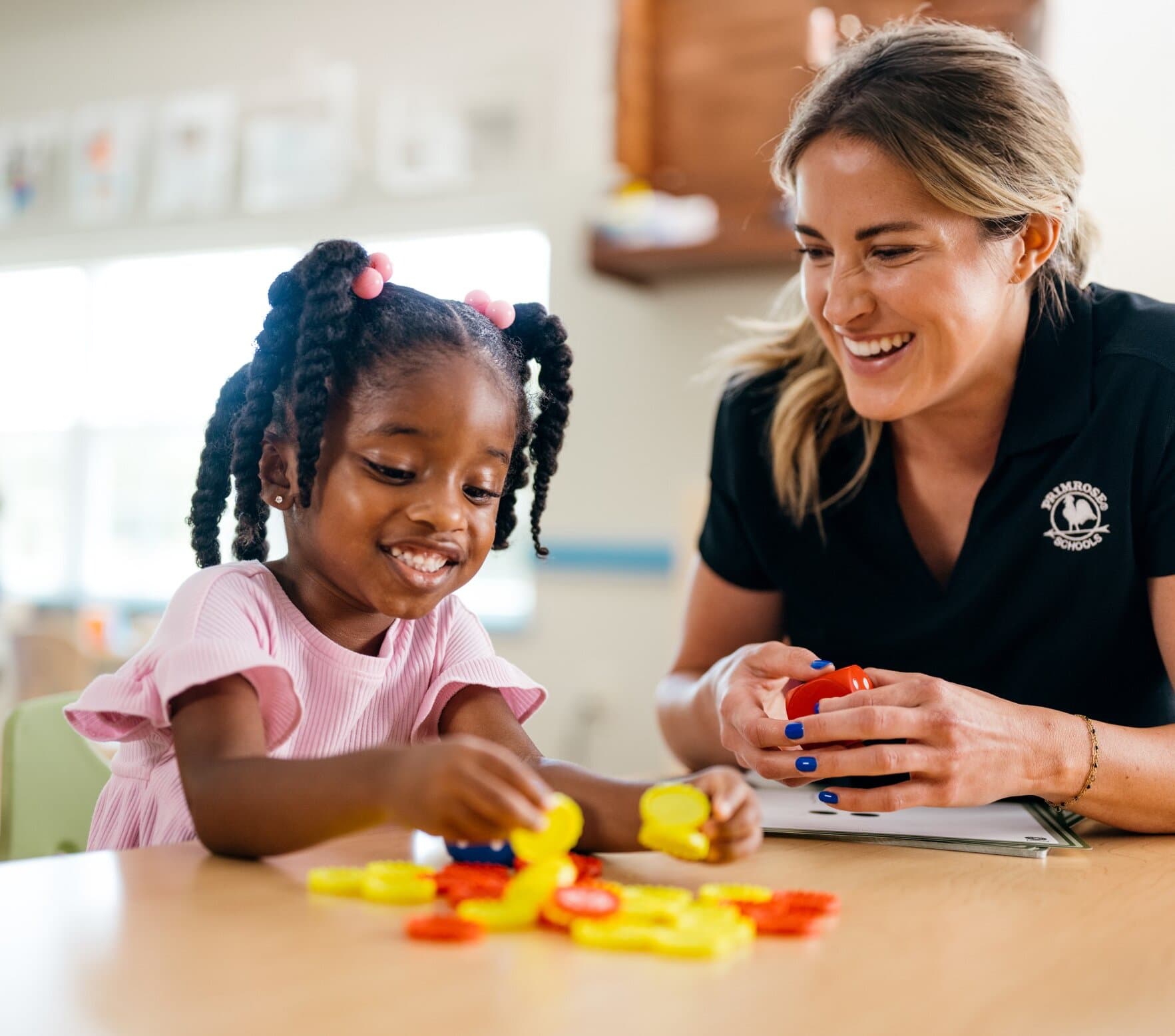 Primrose teacher teaching numbers to preschooler