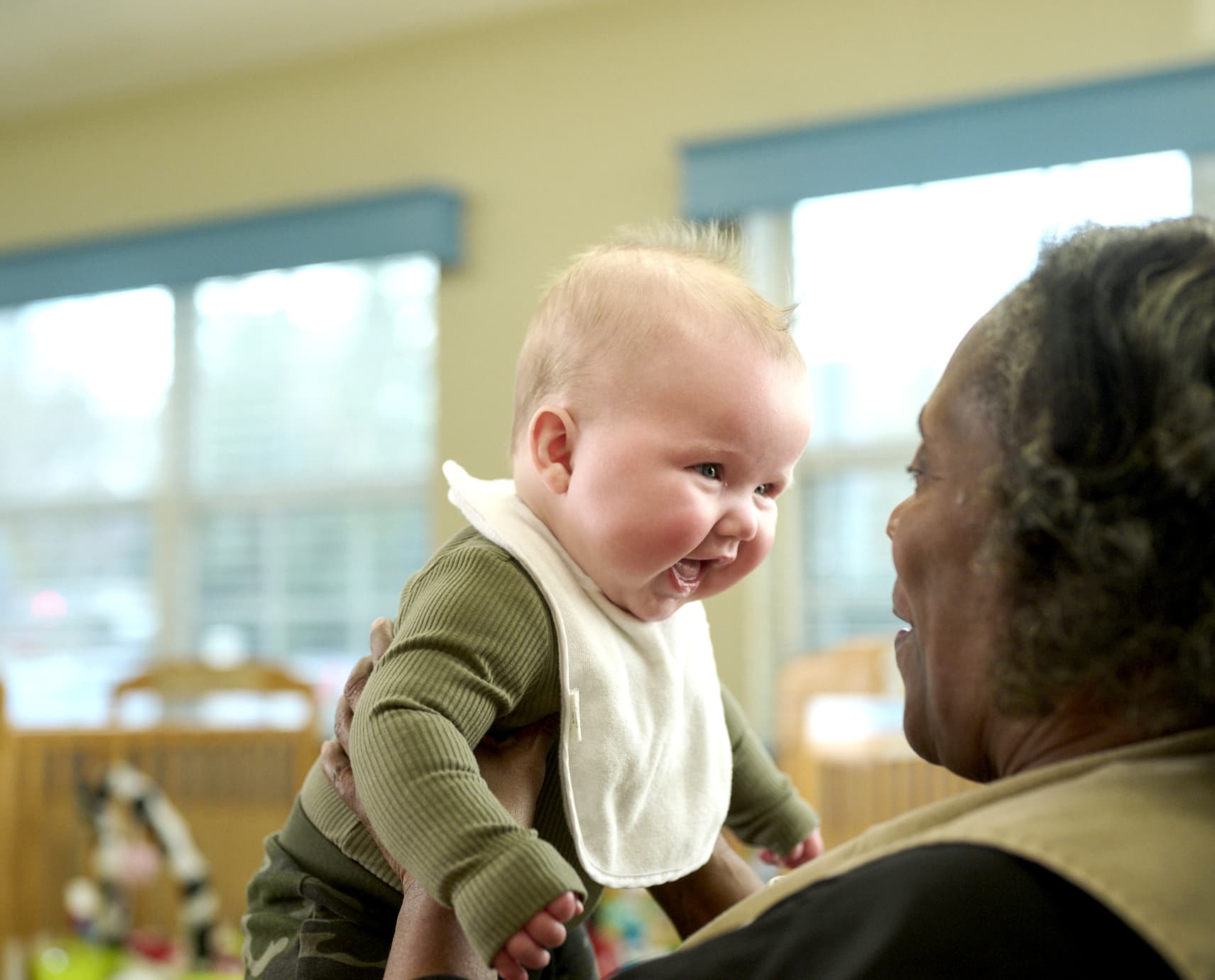 Primrose teacher talking to baby