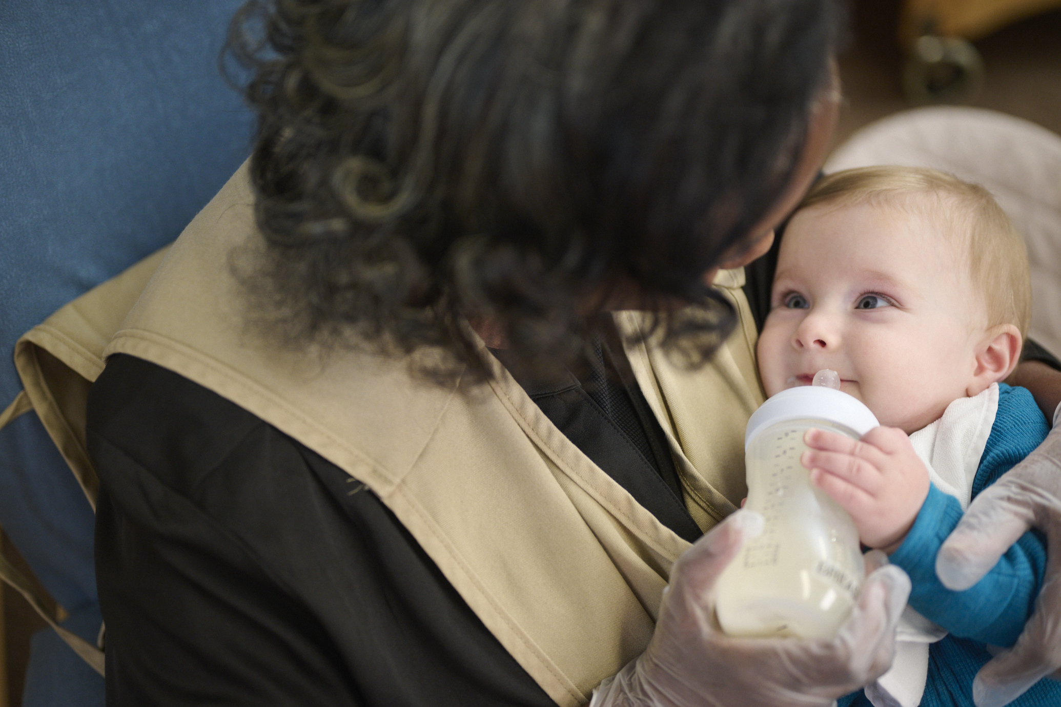 Primrose teacher feeding baby