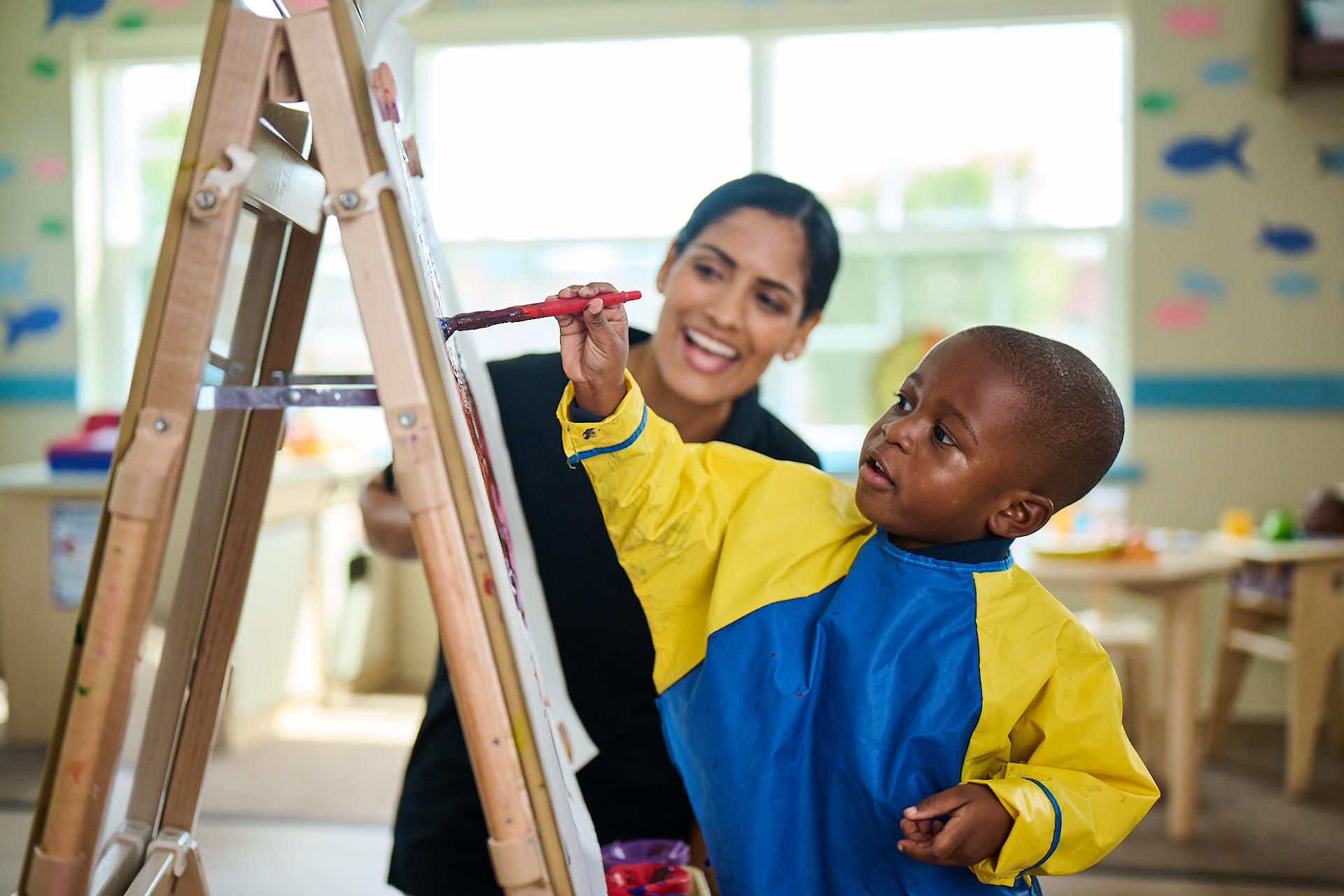 Child painting in the preschool class