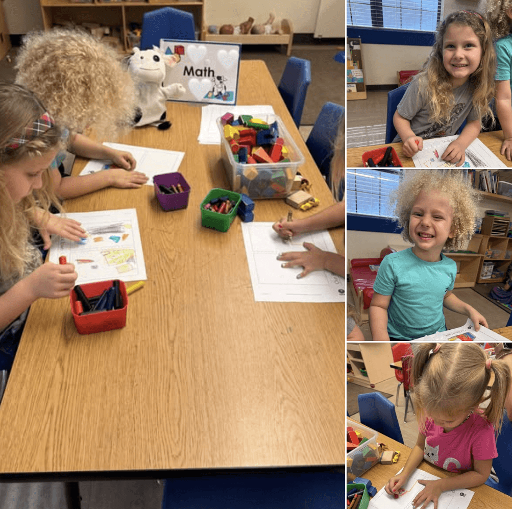 Children posing in front of book fair posters