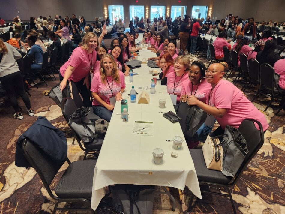 teachers sitting at a table completing professional development
