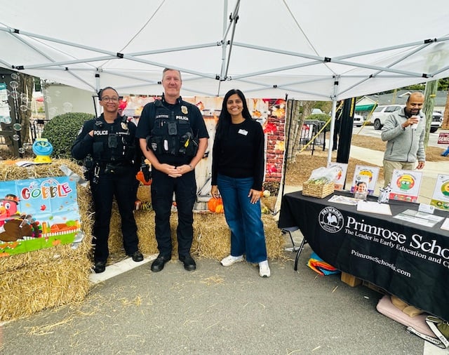 picture of 2 police officers and Sneha in our photo booth