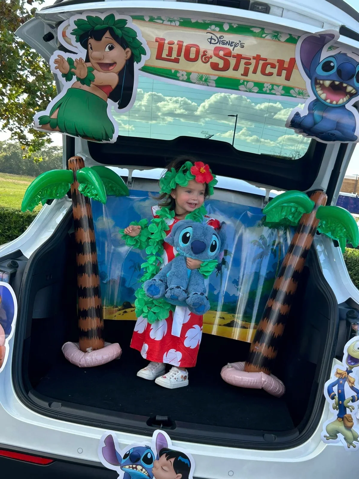 Lilo and stich themed trunk with child dressed up standing in the trunk