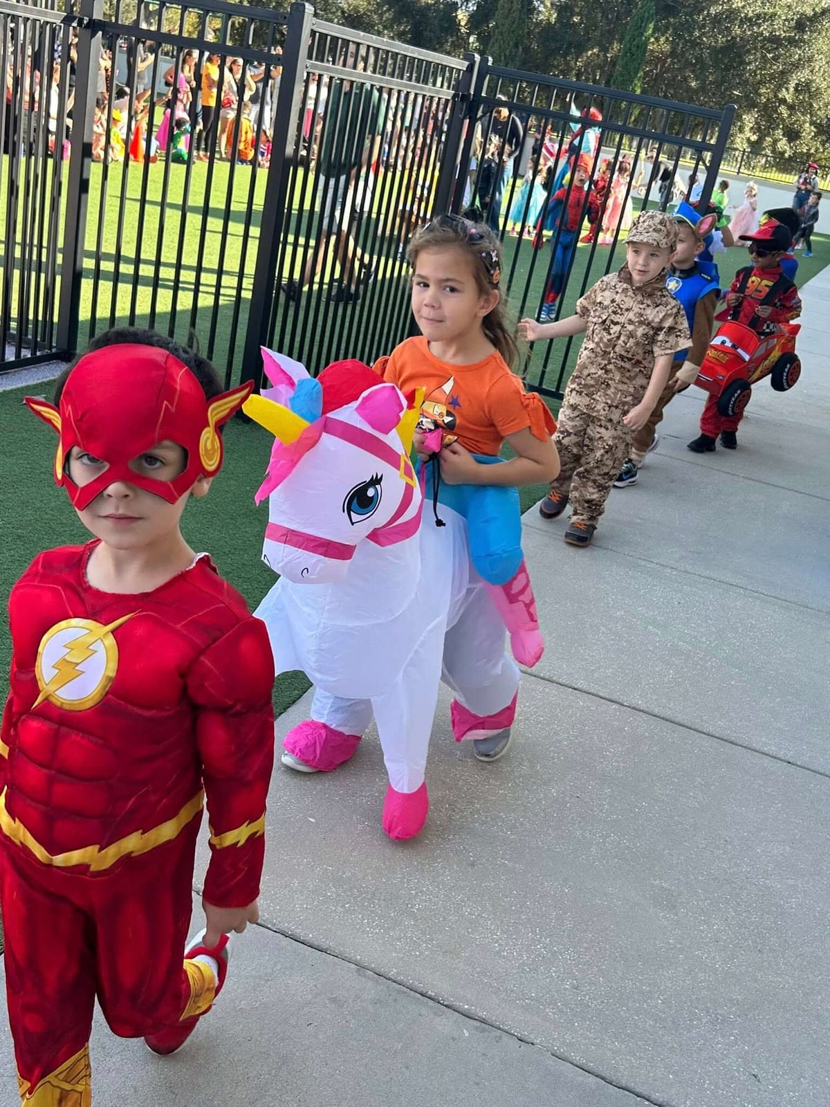children in costumes parading