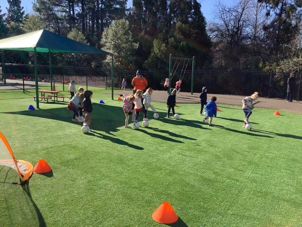 Primrose School students participating in Soccer Shots soccer program during extracurricular activities