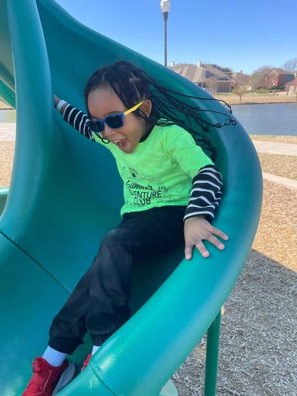 a kid in the best fun after school and private kindergarten program on a field trip to a park near me, saginaw, fort worth, texas, at primrose school