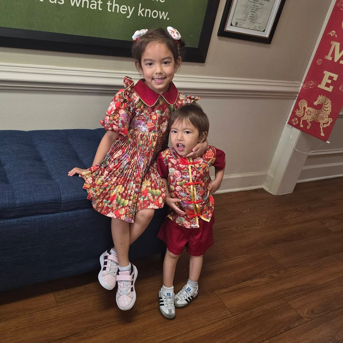 girl in a red dress boy in a red outfit