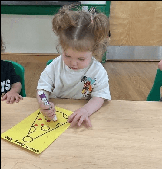 child using a dot marker