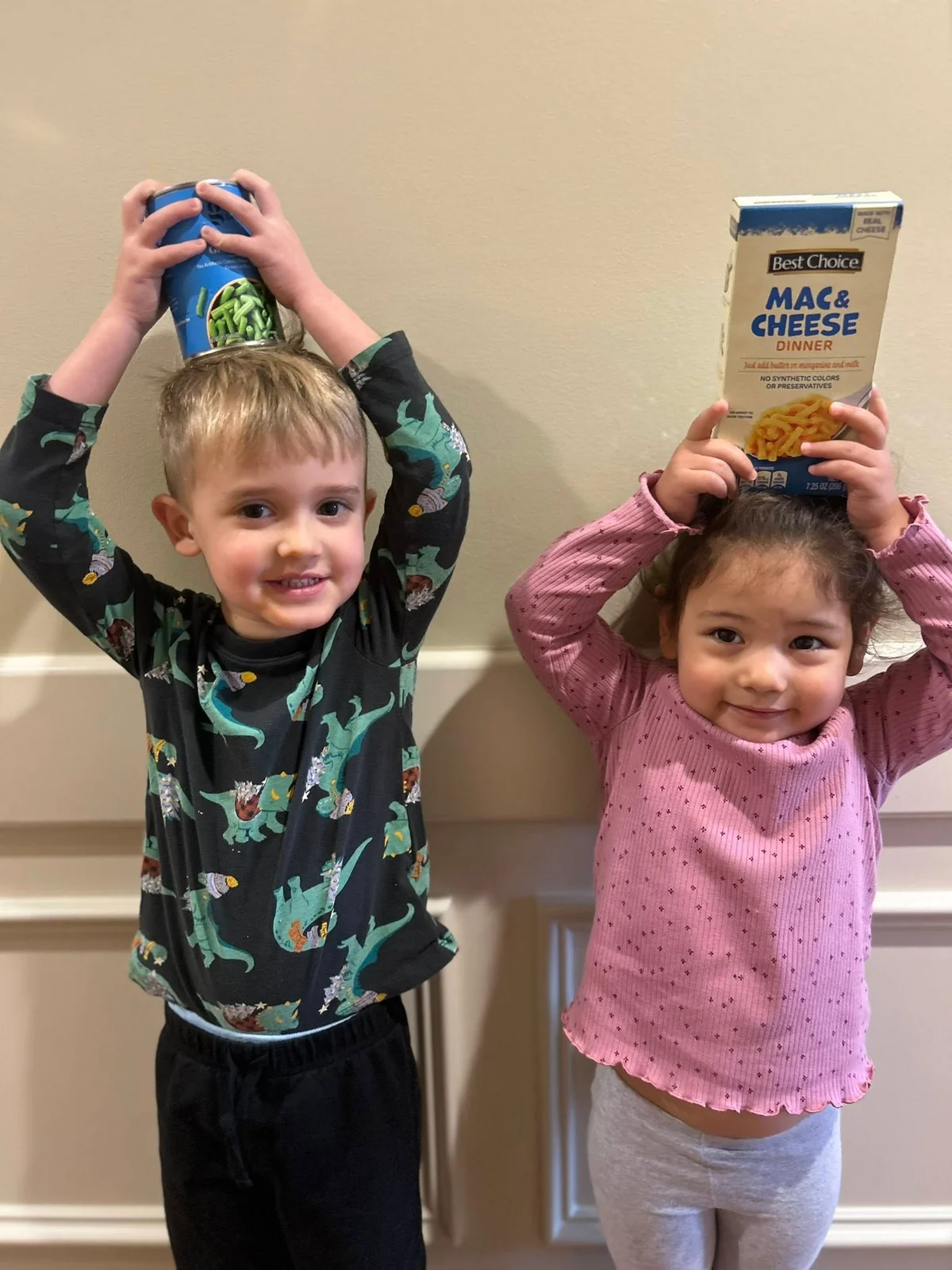 Children holding canned goods