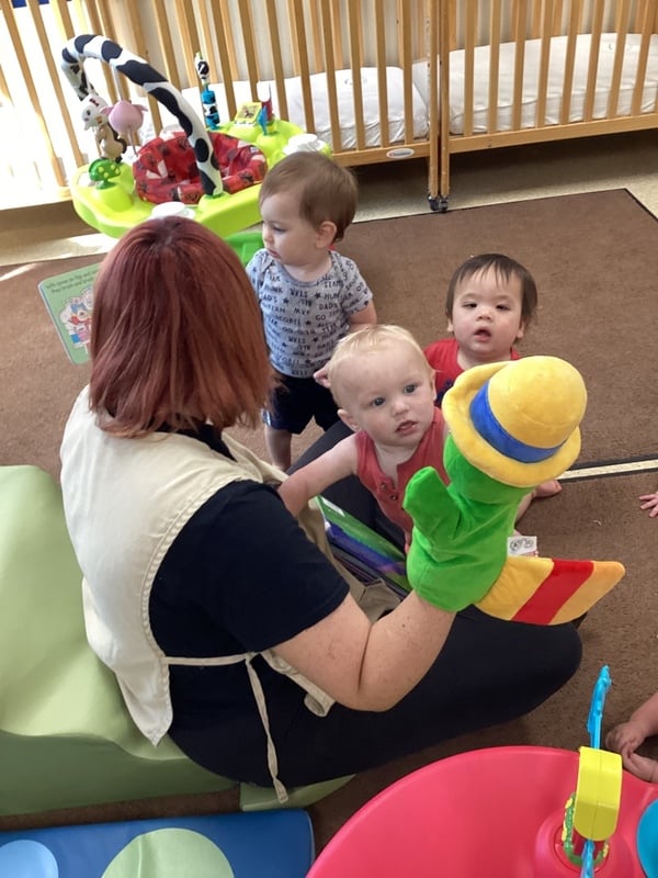 Primrose School of Hixson teacher reading a book