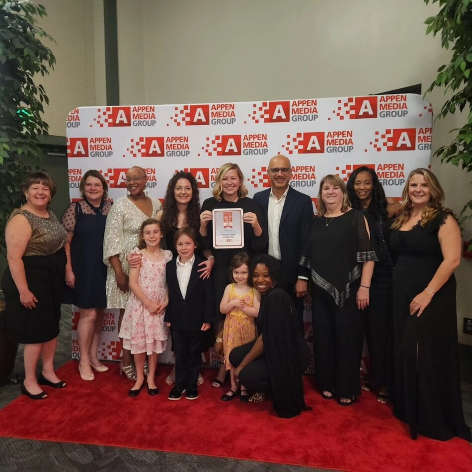 teachers holding award for best of north atlanta