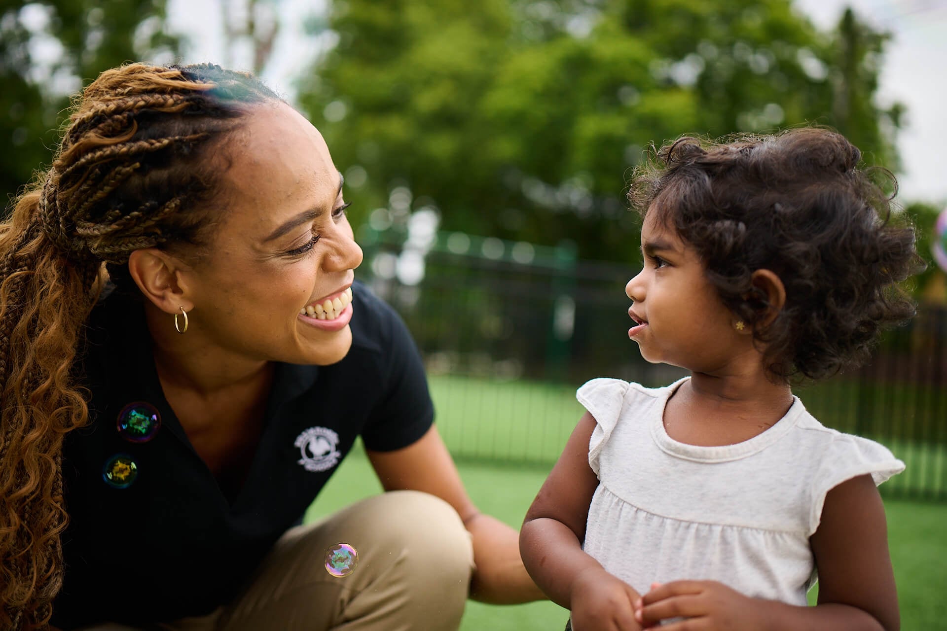 toddler at recess with Primrose teacher
