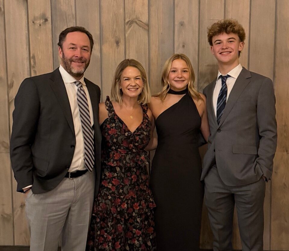 franchise owners keri and carl stoltz with their family