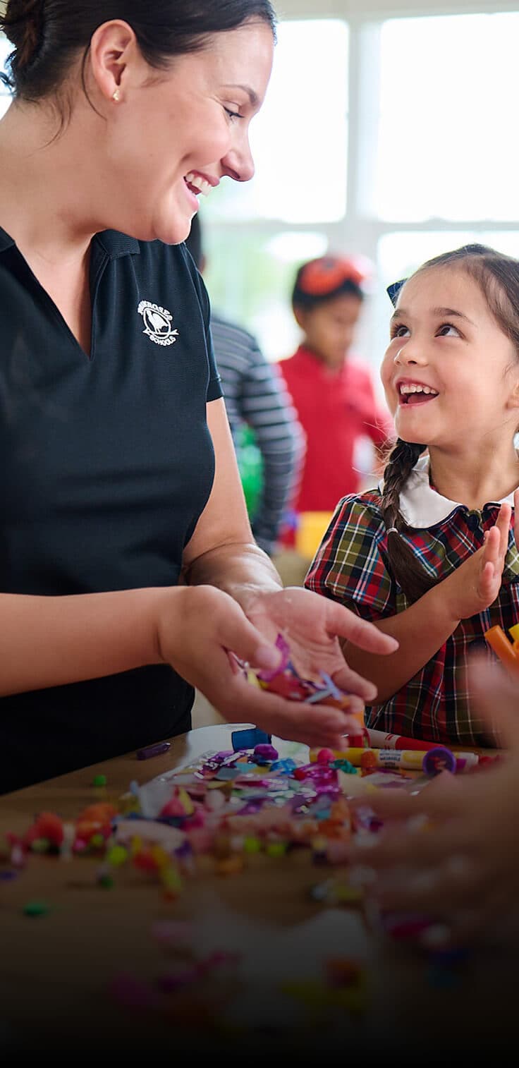 Primrose pre-k teacher teaching arts and crafts to class